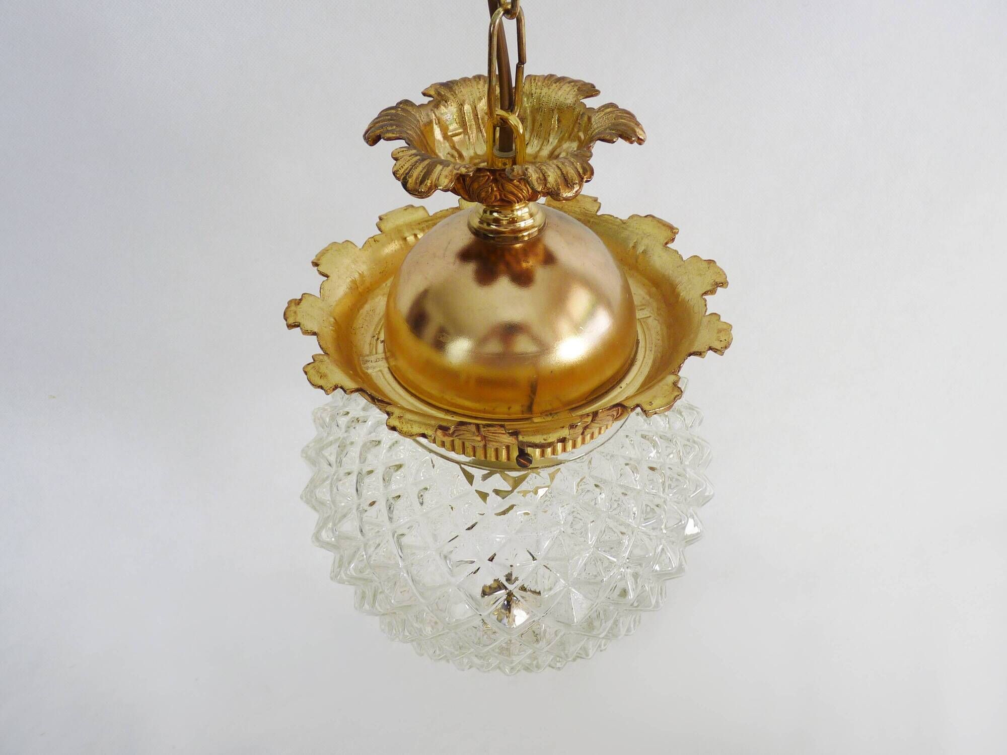 Brass and diamond-tipped chiseled glass globe hanging lamp