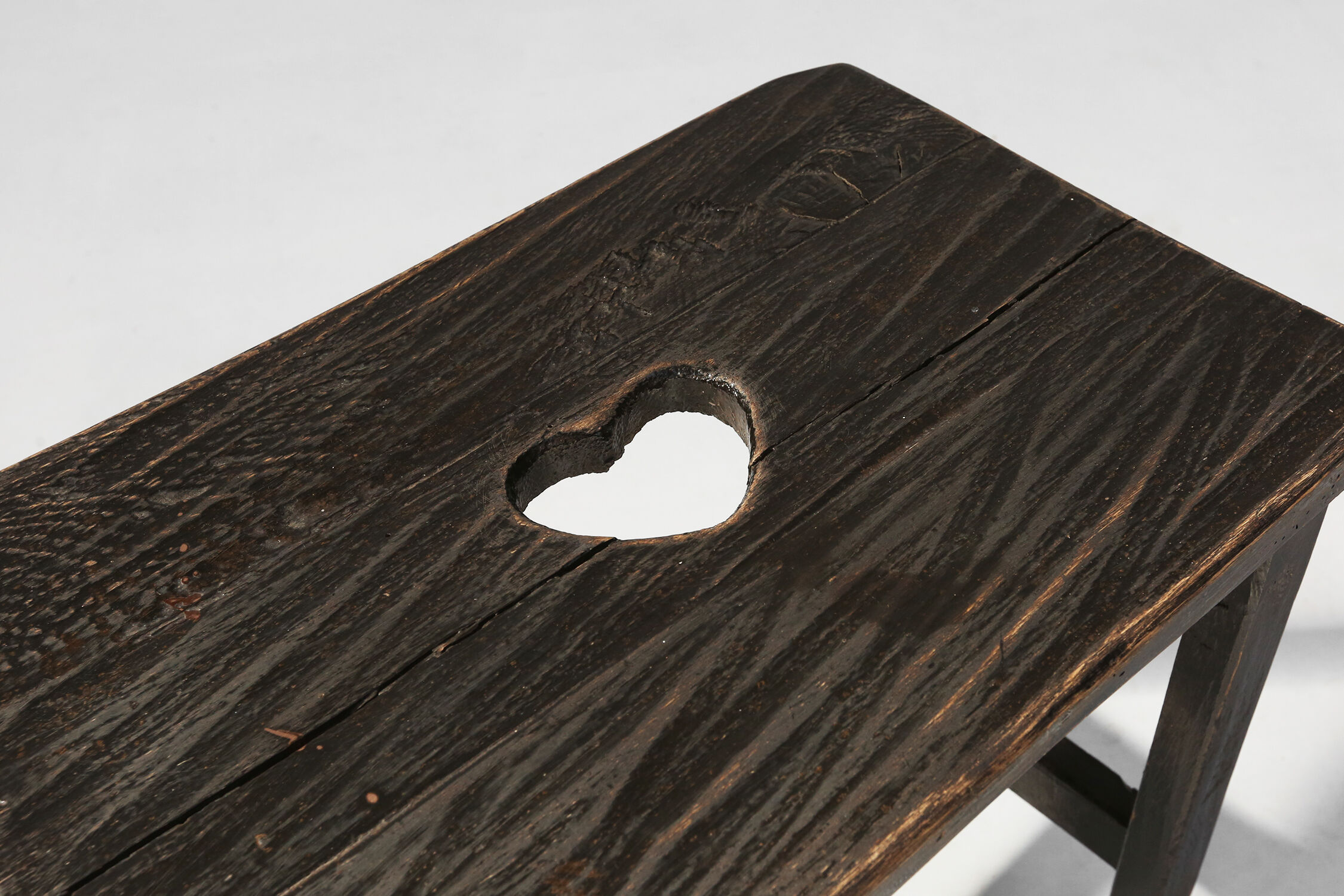 Rustic black wooden stool, Ca.1920