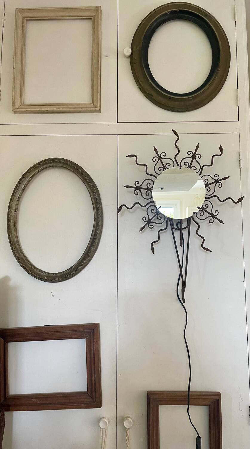 Luminous wrought iron sun mirror