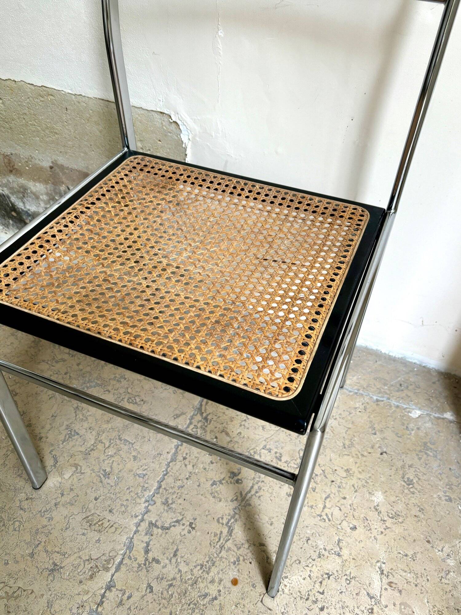 Chair in chrome metal, black wood and canework