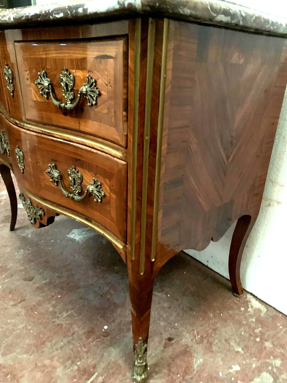 Louis XV saute chest of drawers with curved facade 18th century