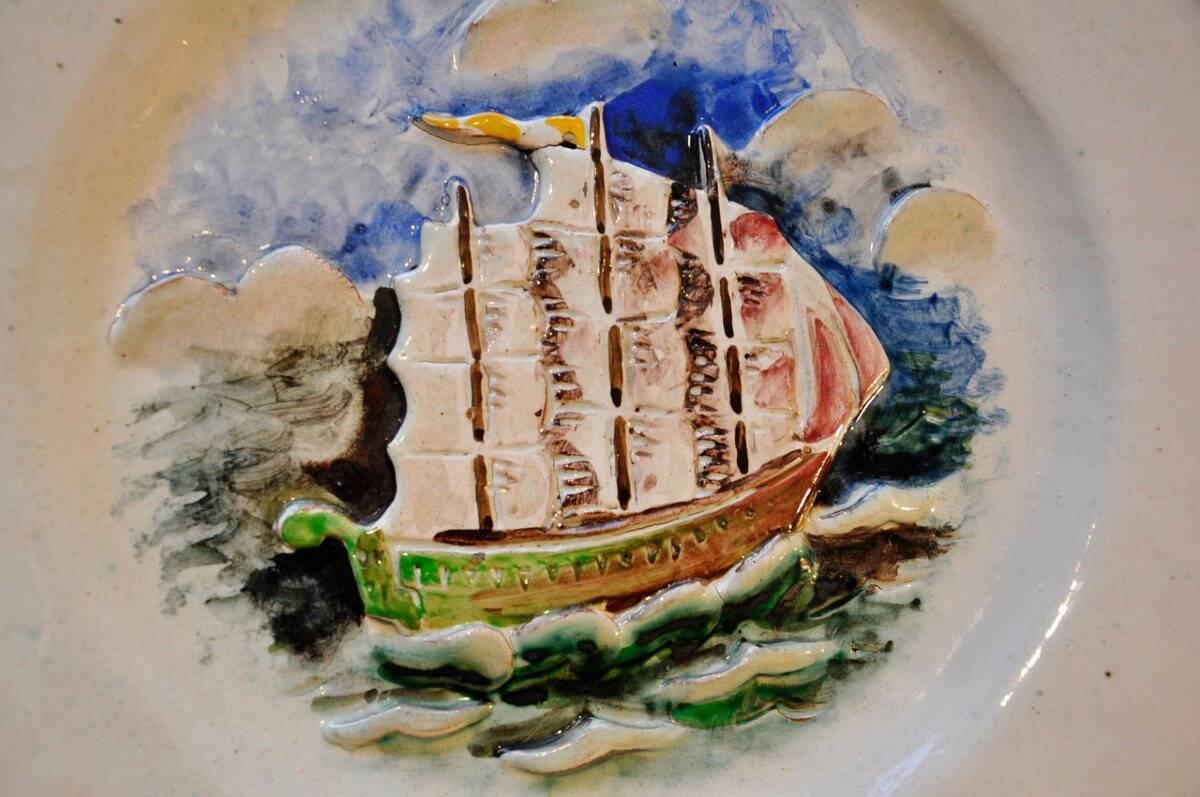 Ceramic dish signed Marc Roussel representing a sailboat, 20th century period
