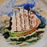 Ceramic dish signed Marc Roussel representing a sailboat, 20th century period