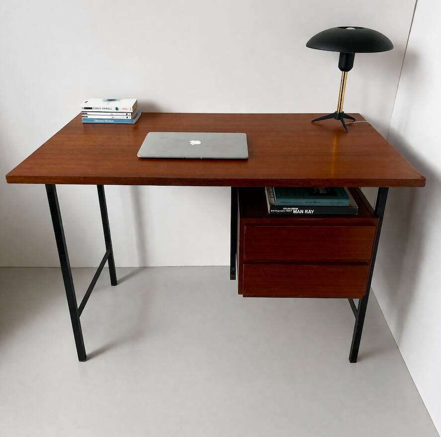 Vintage wooden and metal desk in modernist style.