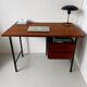 Vintage wooden and metal desk in modernist style.