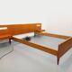 Double bed in vintage Scandinavian style from the 1960s with bedside tables.