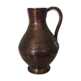 Skidded copper pitcher