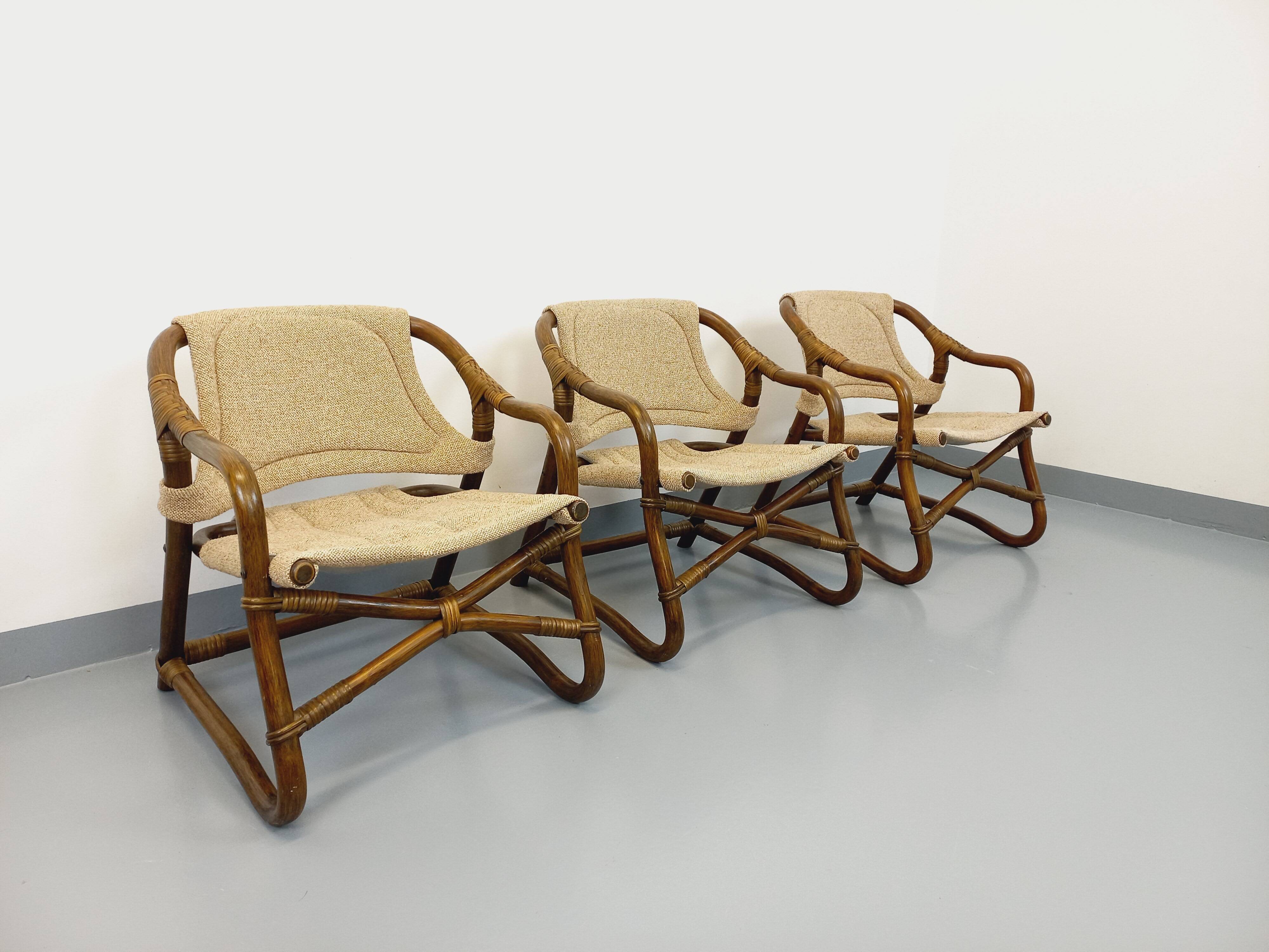 Set of 3 vintage Danish safari-style armchairs from Horsnæs Møbelfabrik in rattan and fabric from the 1980s.