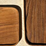 Trio of rounded rectangular trays or cups in monoxyl teak L:35
