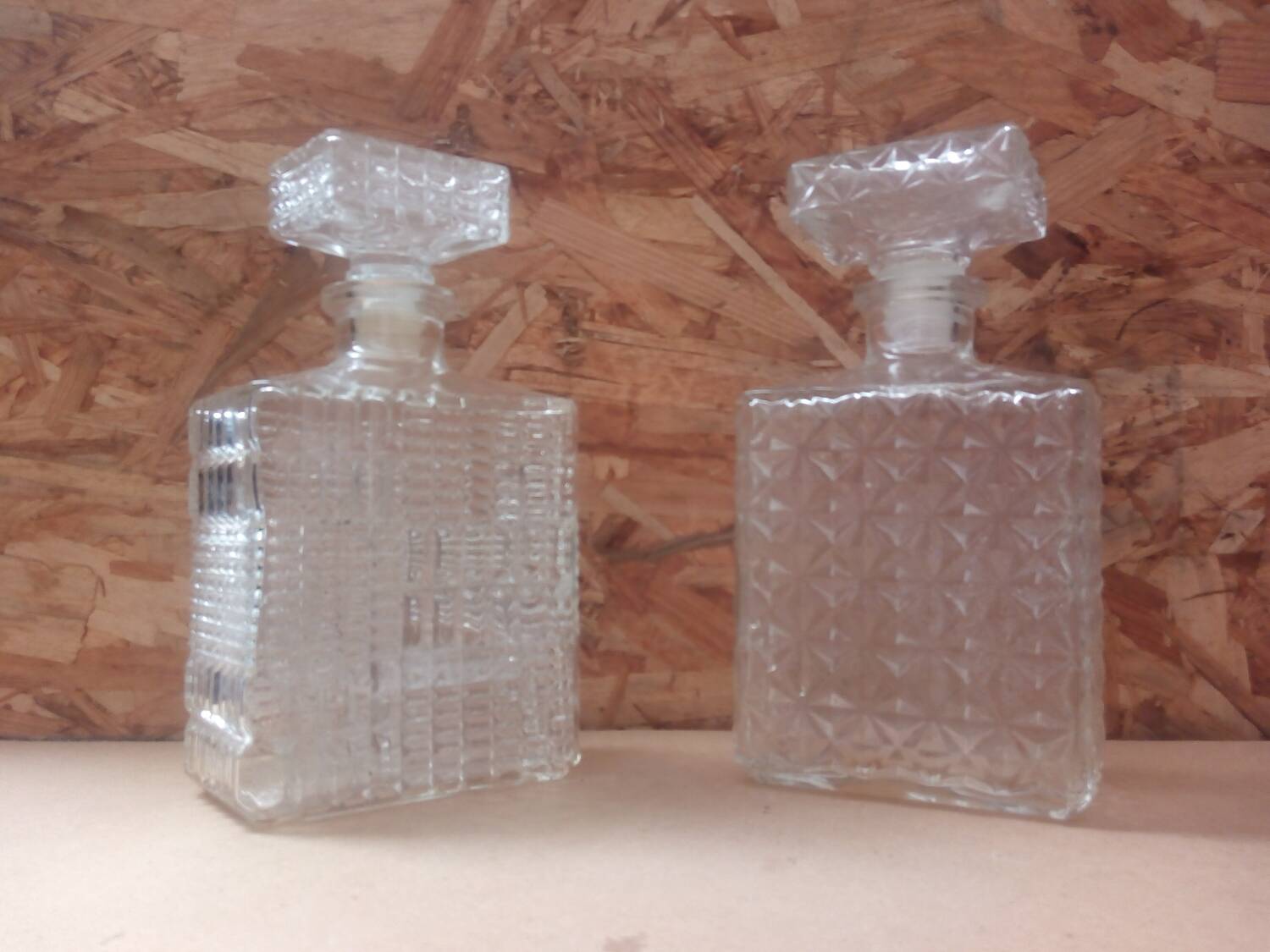 Pair of molded glass whiskey liqueur carafes + vintage stoppers