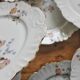 12 assiettes à dessert en porcelaine ancienne décor polychrome floral début XXe