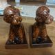 Press book in the shape of a dog made of ceramic.
