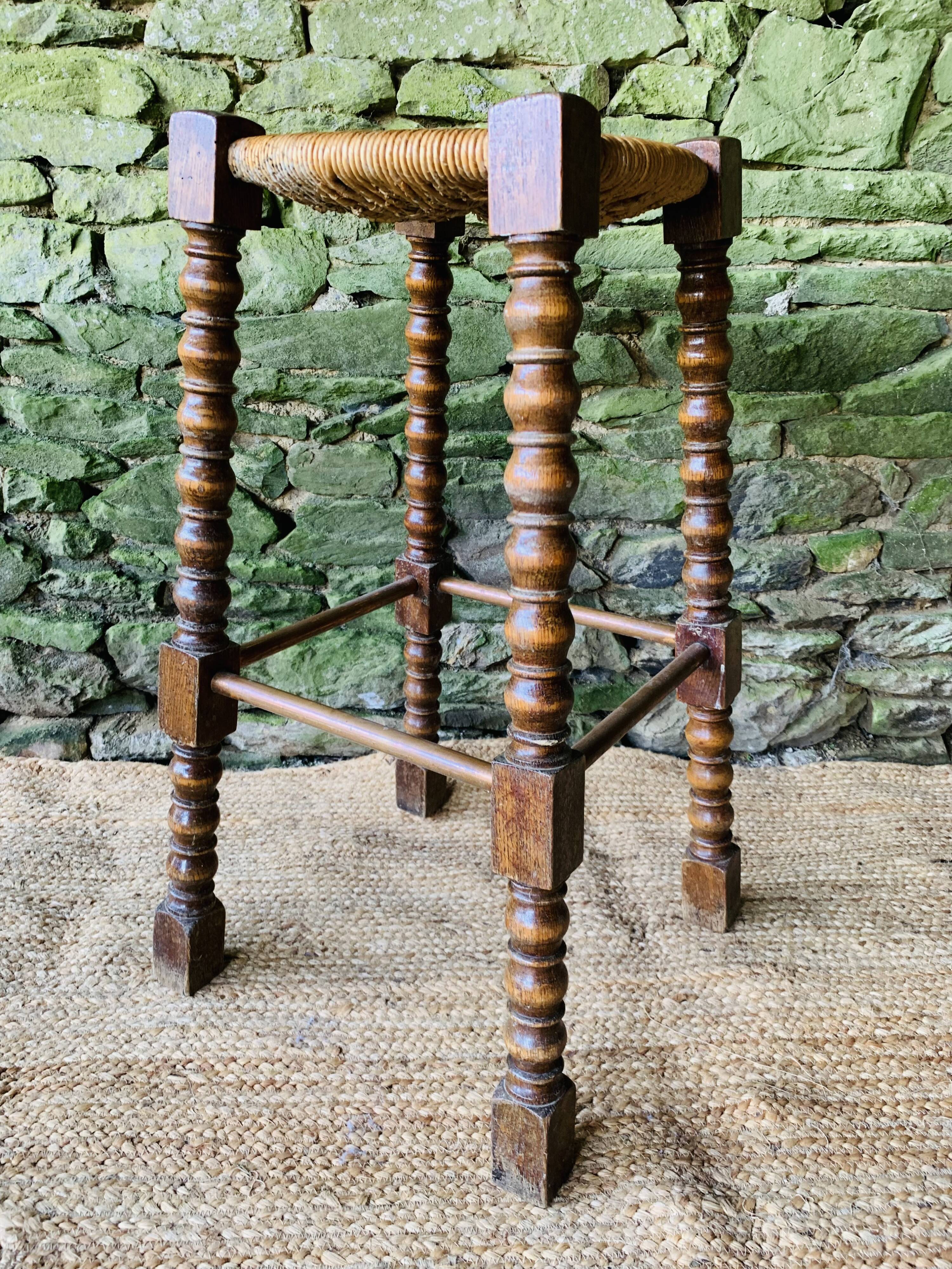 High stool in turned wood