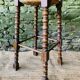 High wooden turned stool