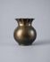 Vintage brass vase from the 1960s, spherical shape with a wavy rim.