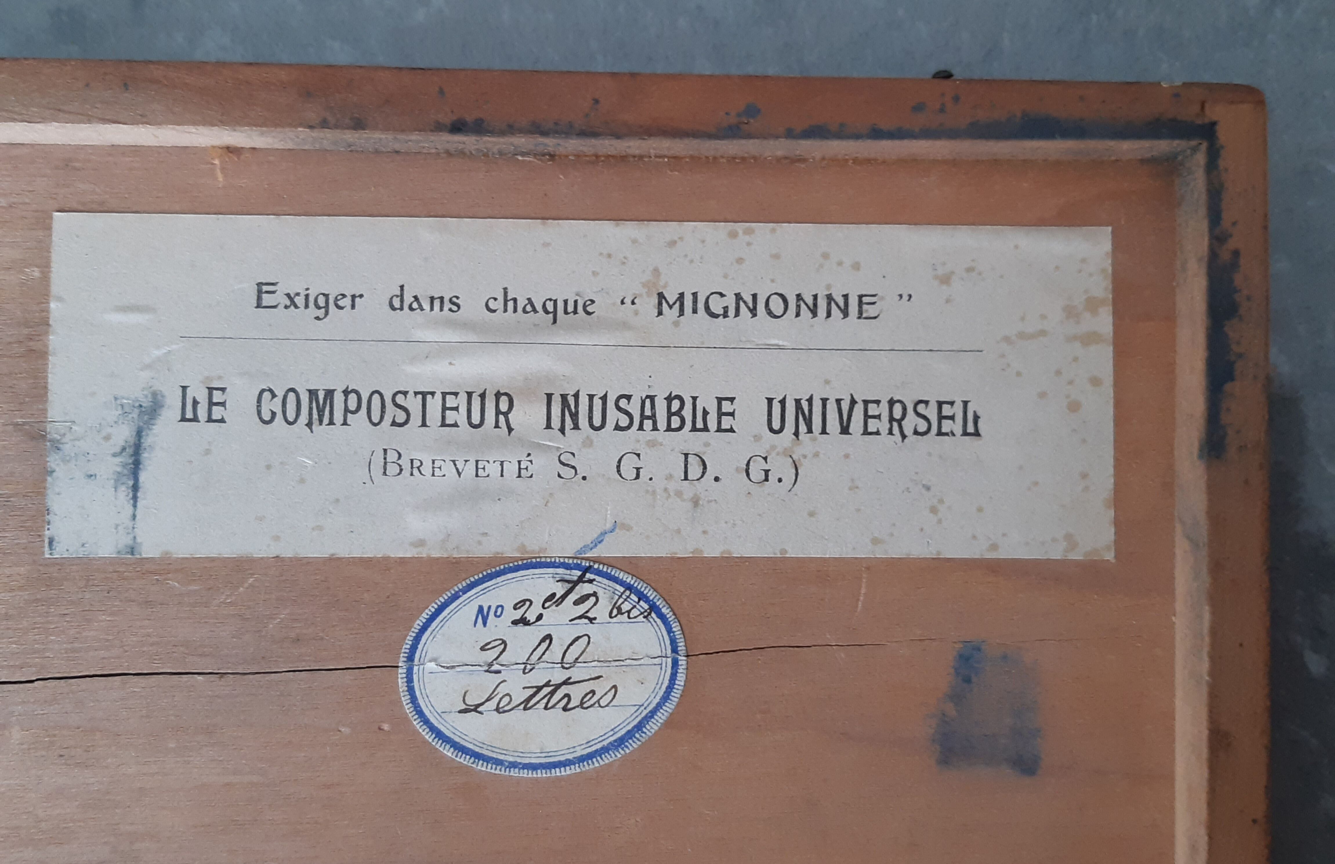 Wooden box containing 30 antique thimbles