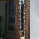 Antique brass repoussé mirror with wooden backing, 59x31 cm, C831.