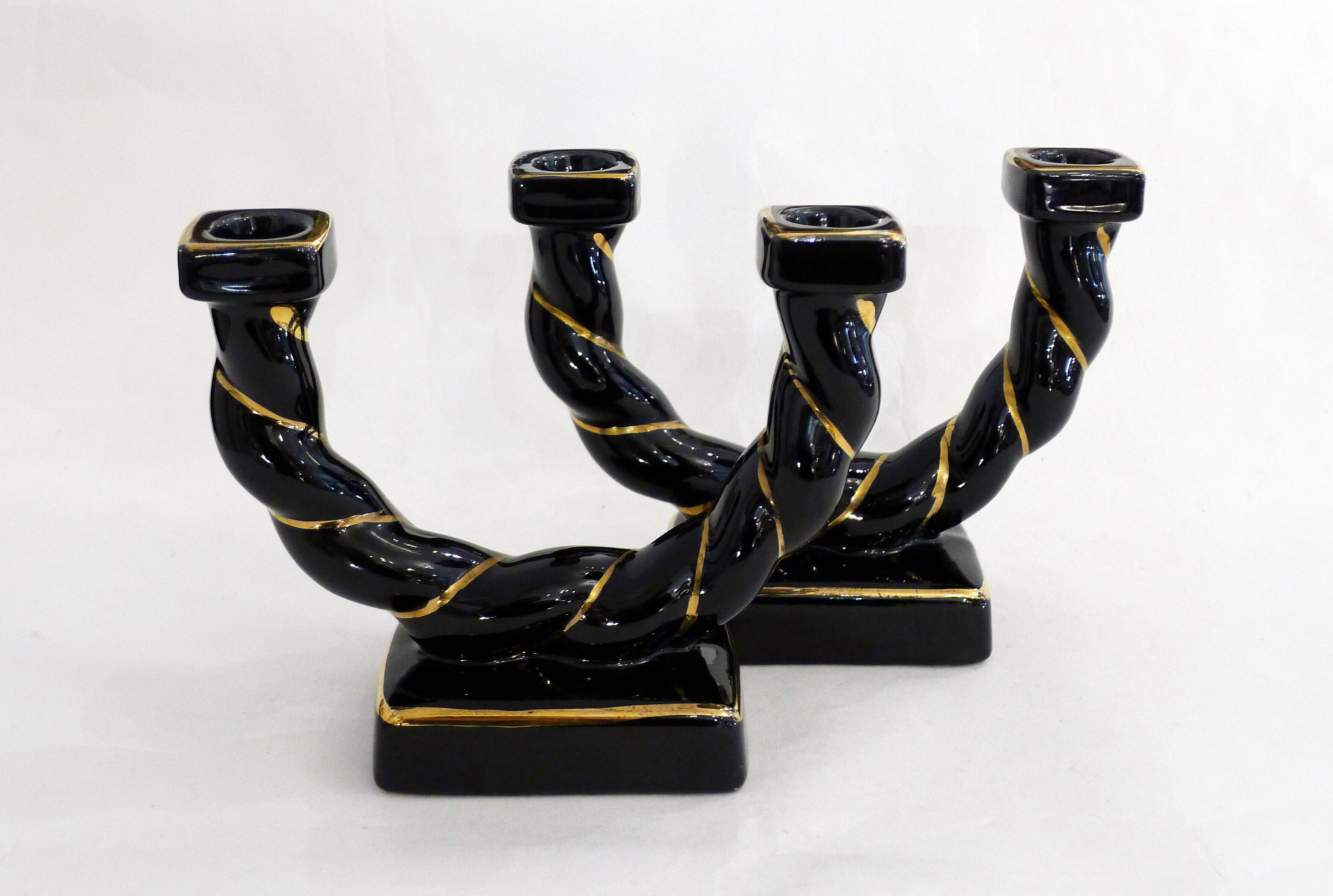 Pair of earthenware braided rope candlesticks