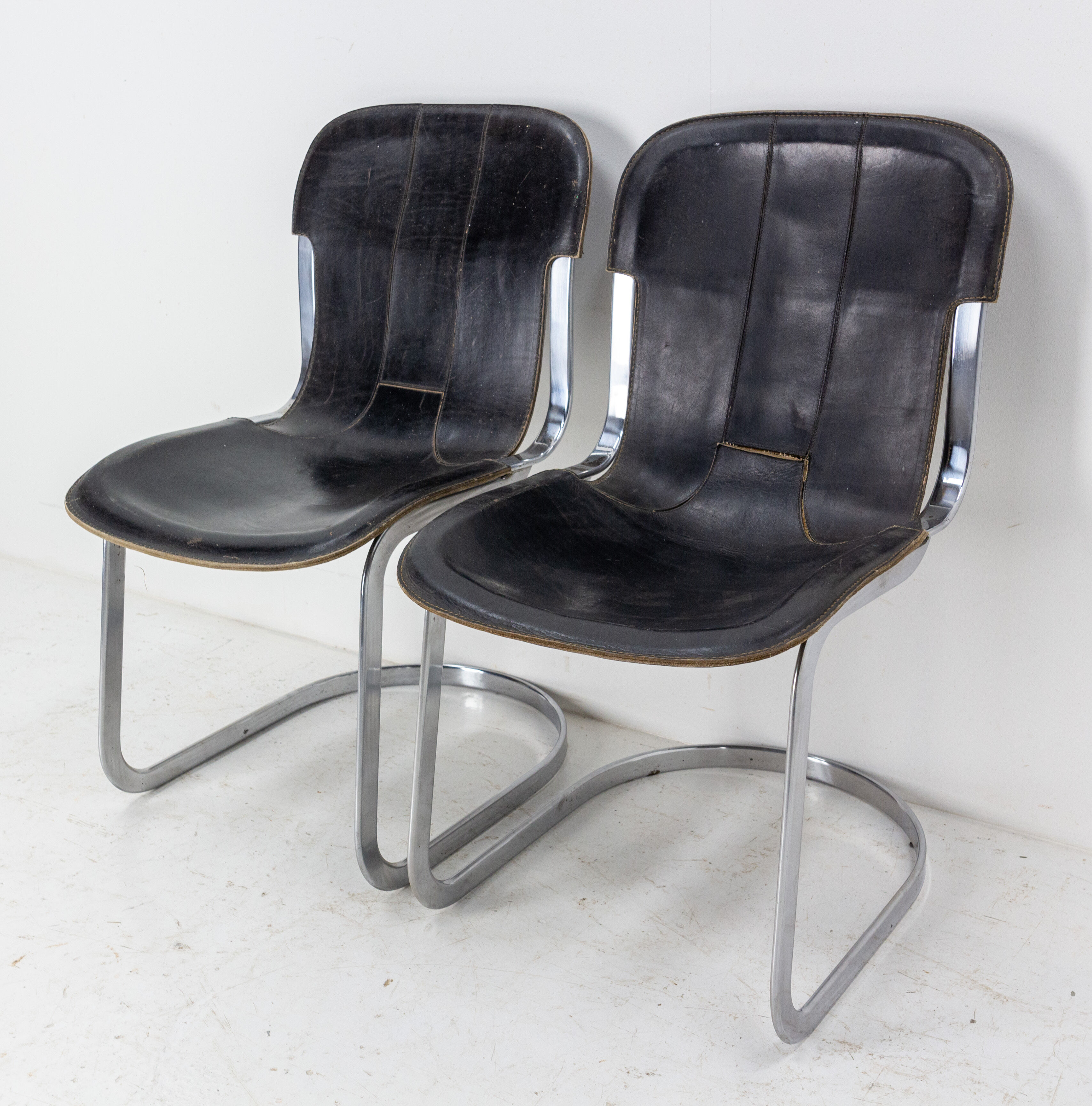 Pair of windmill leather chairs