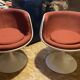 Two cognac-colored swivel chairs made of fiberglass from the 1970s
