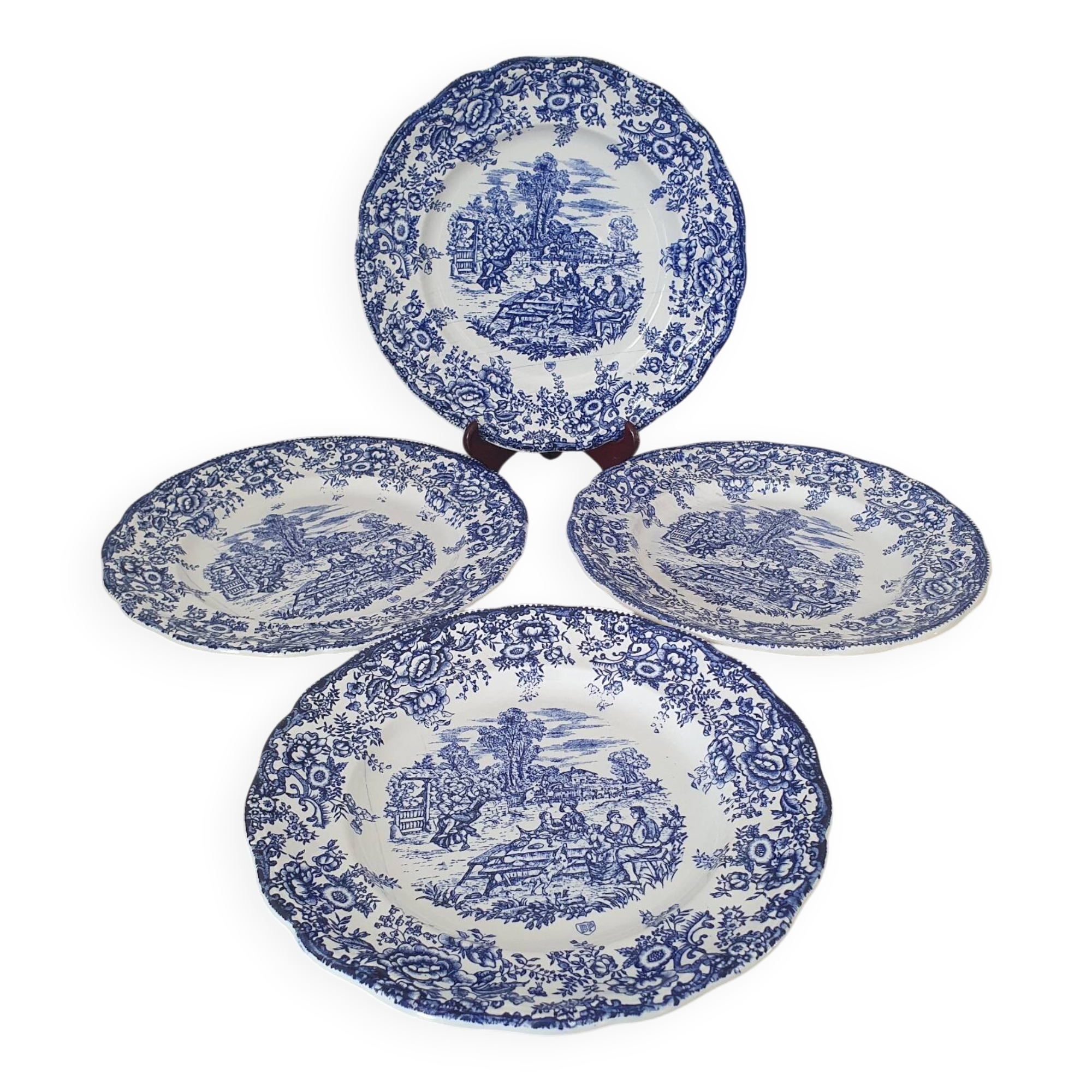 4 earthenware plates with floral and pastoral scene motif