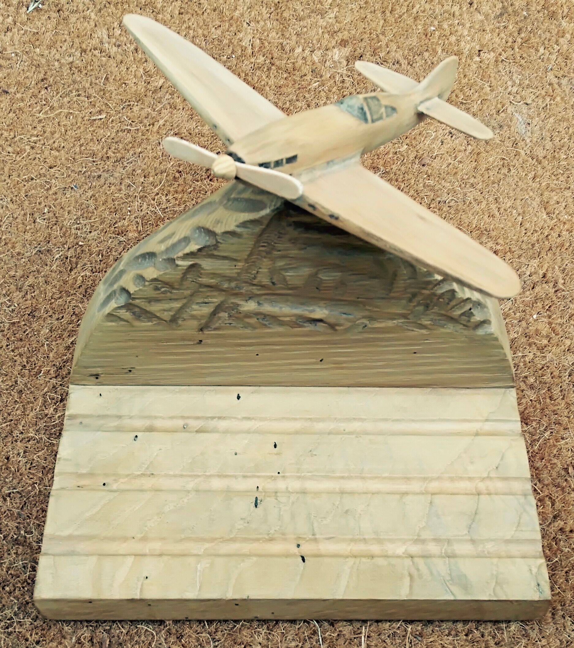 Wooden plane carved on its base, pen holder