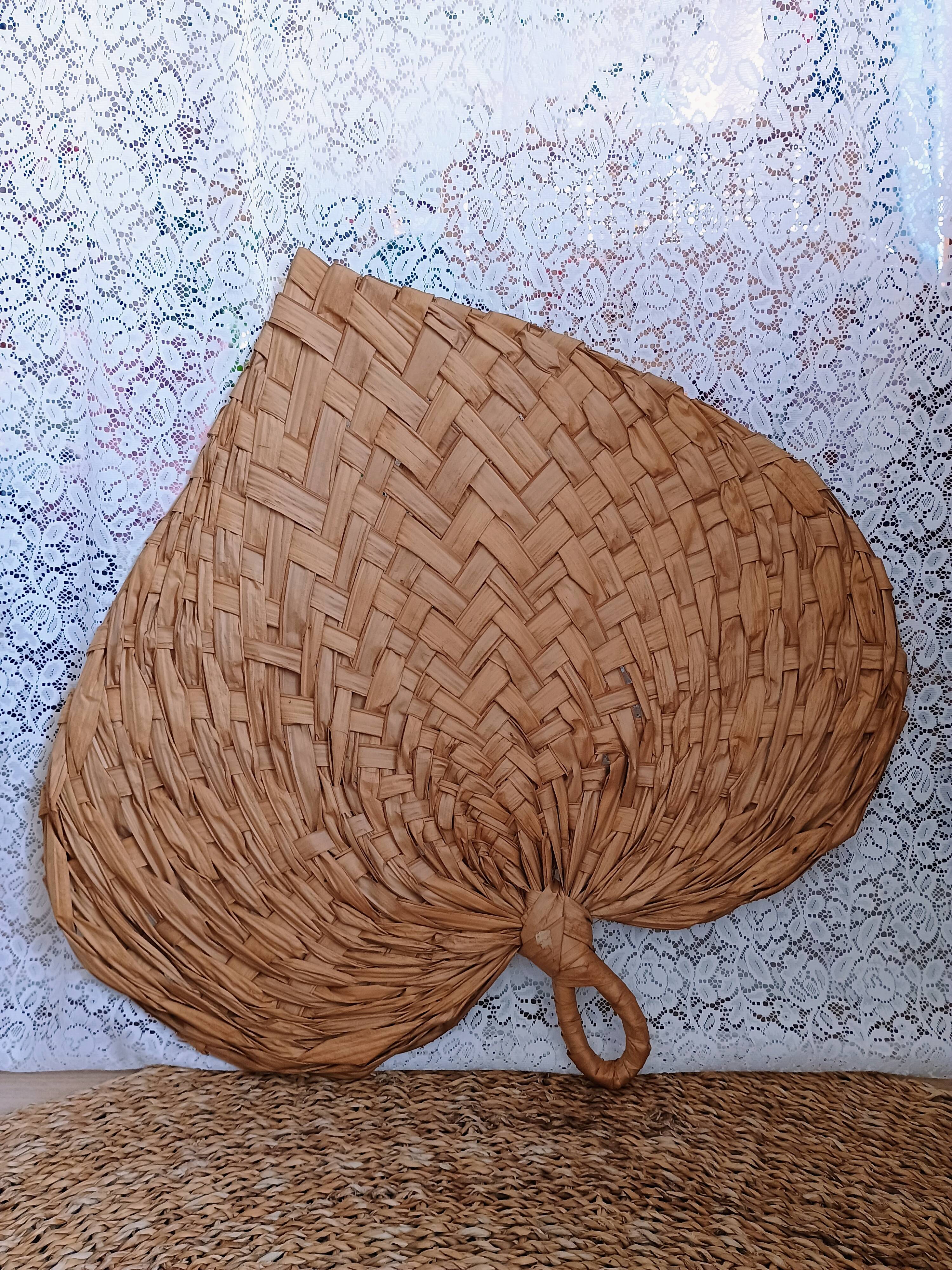 Heart fan in vintage woven palm leaves