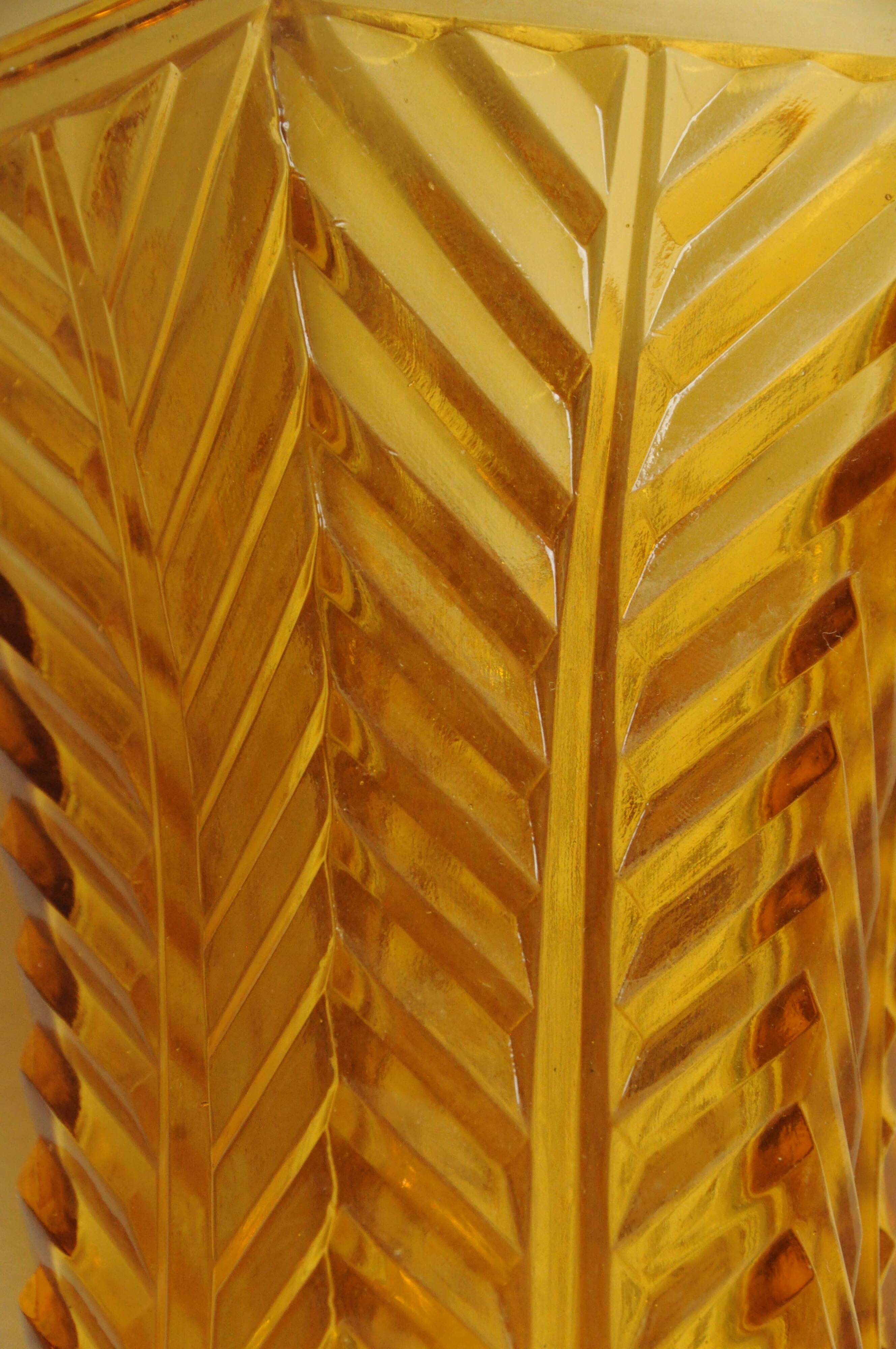 Vintage Art Deco vase in amber yellow cut glass with geometric design.
