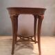 Round pedestal table in veneer wood
