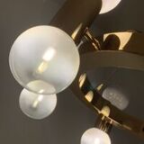 Annular chandelier with gradient white spheres
