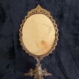 Swivel table mirror in golden metal