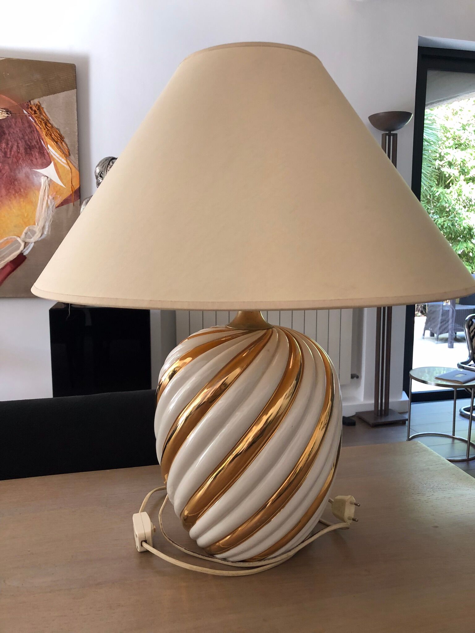 Pair of lamps of the brand Koska in white and twisted gold, with lampshade