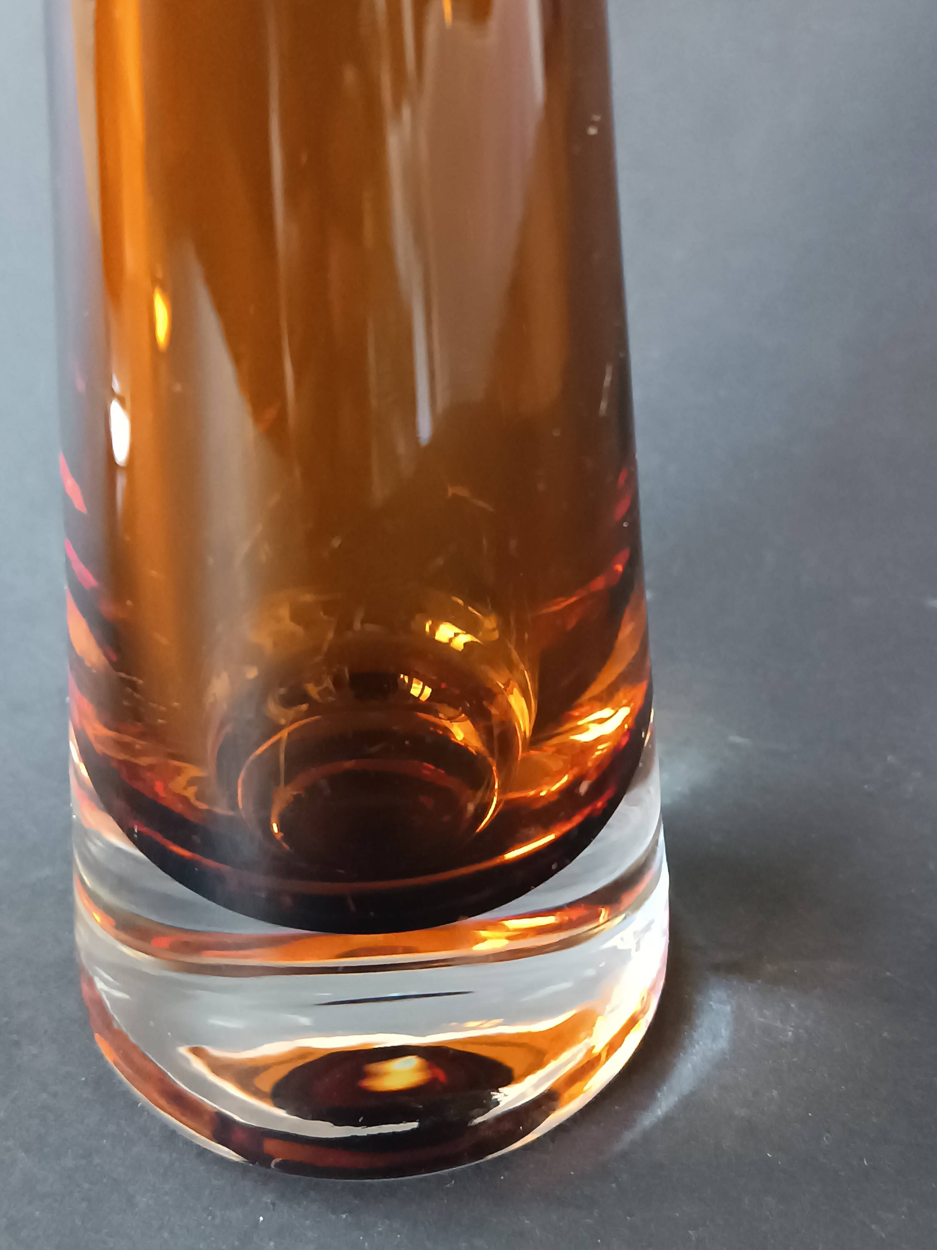 Two vintage Scandinavian double-layered amber blown glass candlesticks