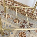 Pair of bedside tables with gold metal and mirrored glass top.