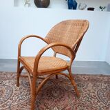 Pair of armchairs in braided rattan 70s