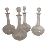 Crystal carafes with a neck and faceted base.