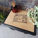Black bedside table and raw wood