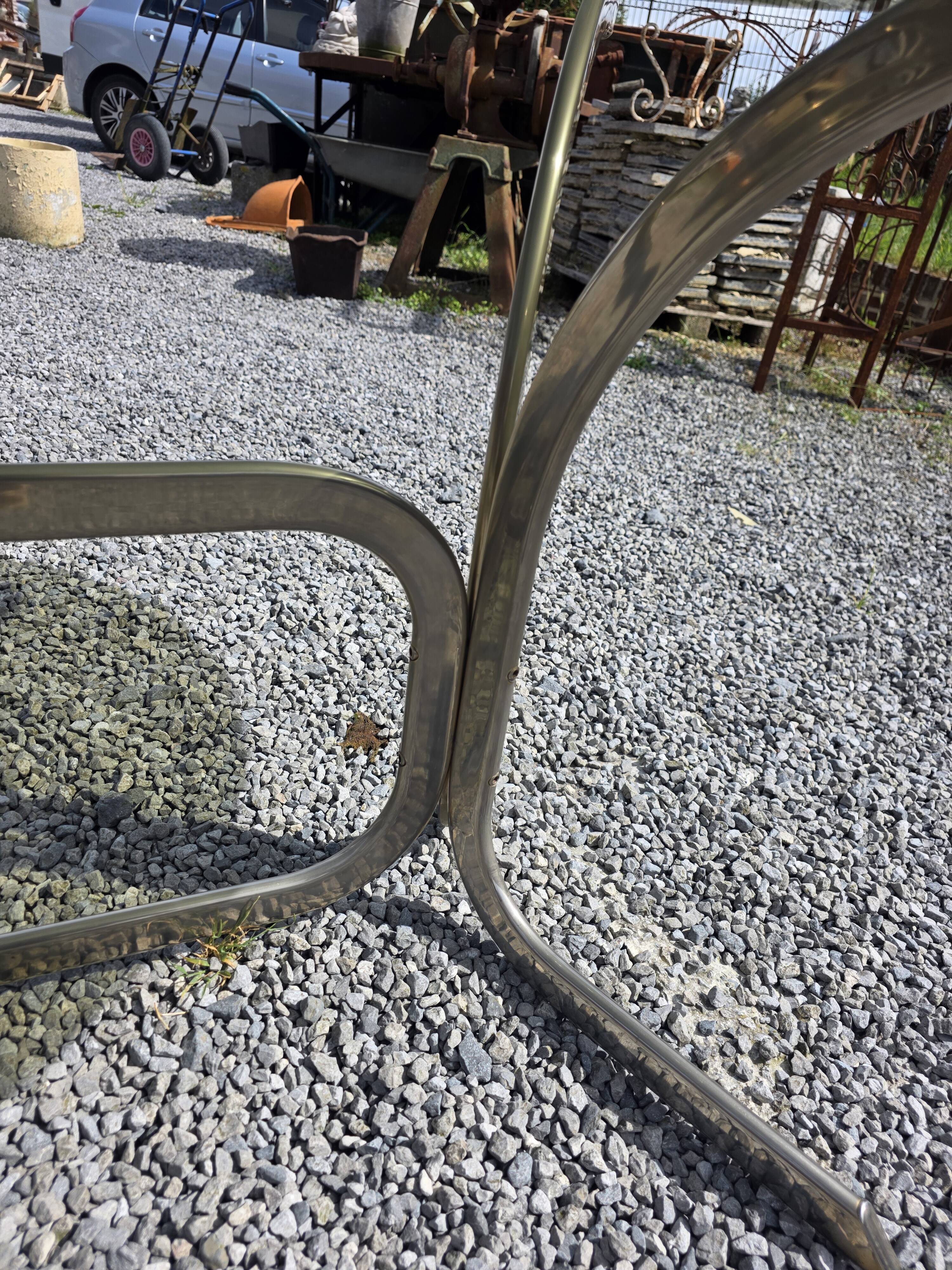 Silver metal table with smoked glass top from the 1970s.
