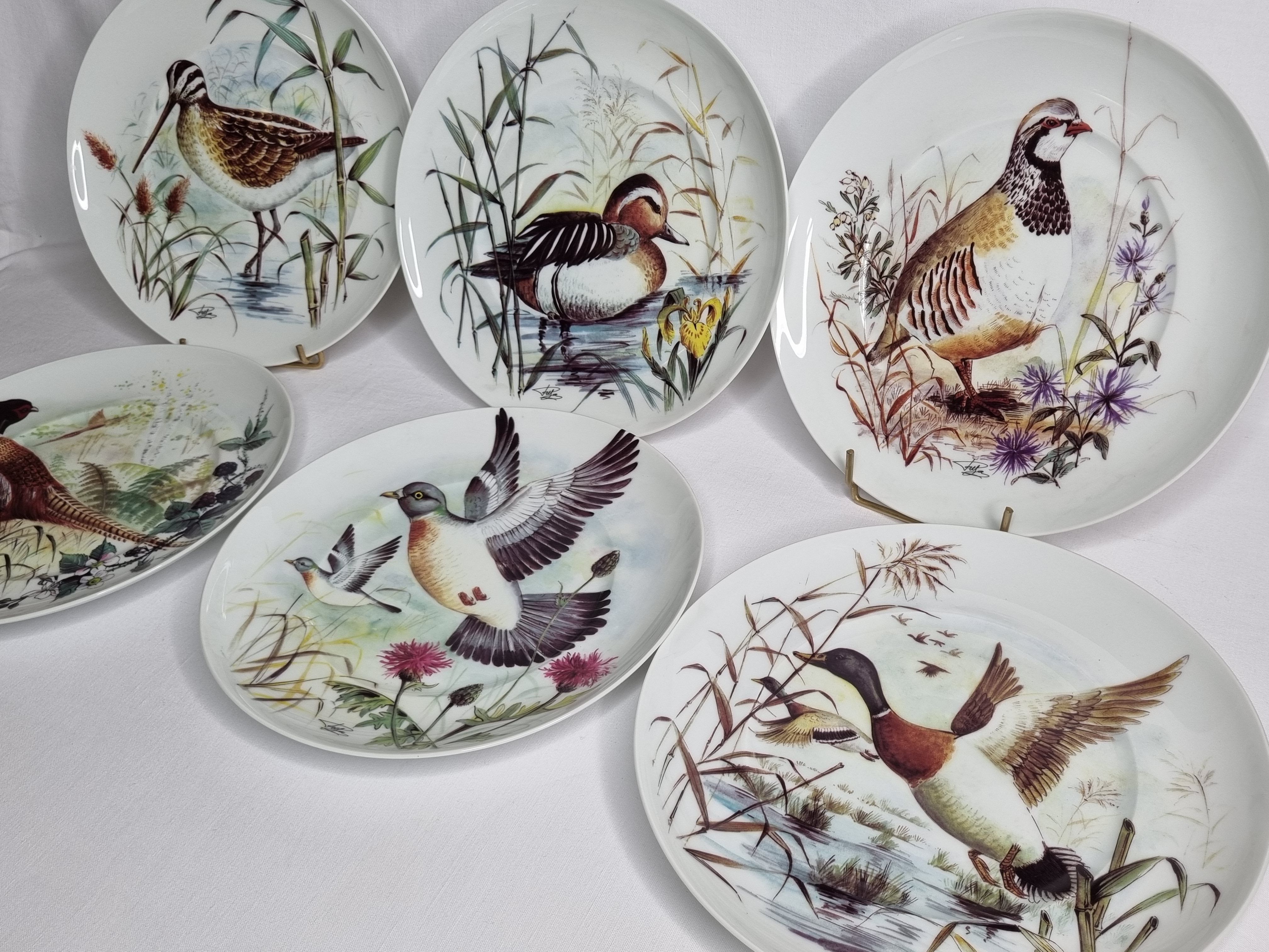 Set of six porcelain plates decorated with birds from Sologne, Limoges, signed, 25 cm