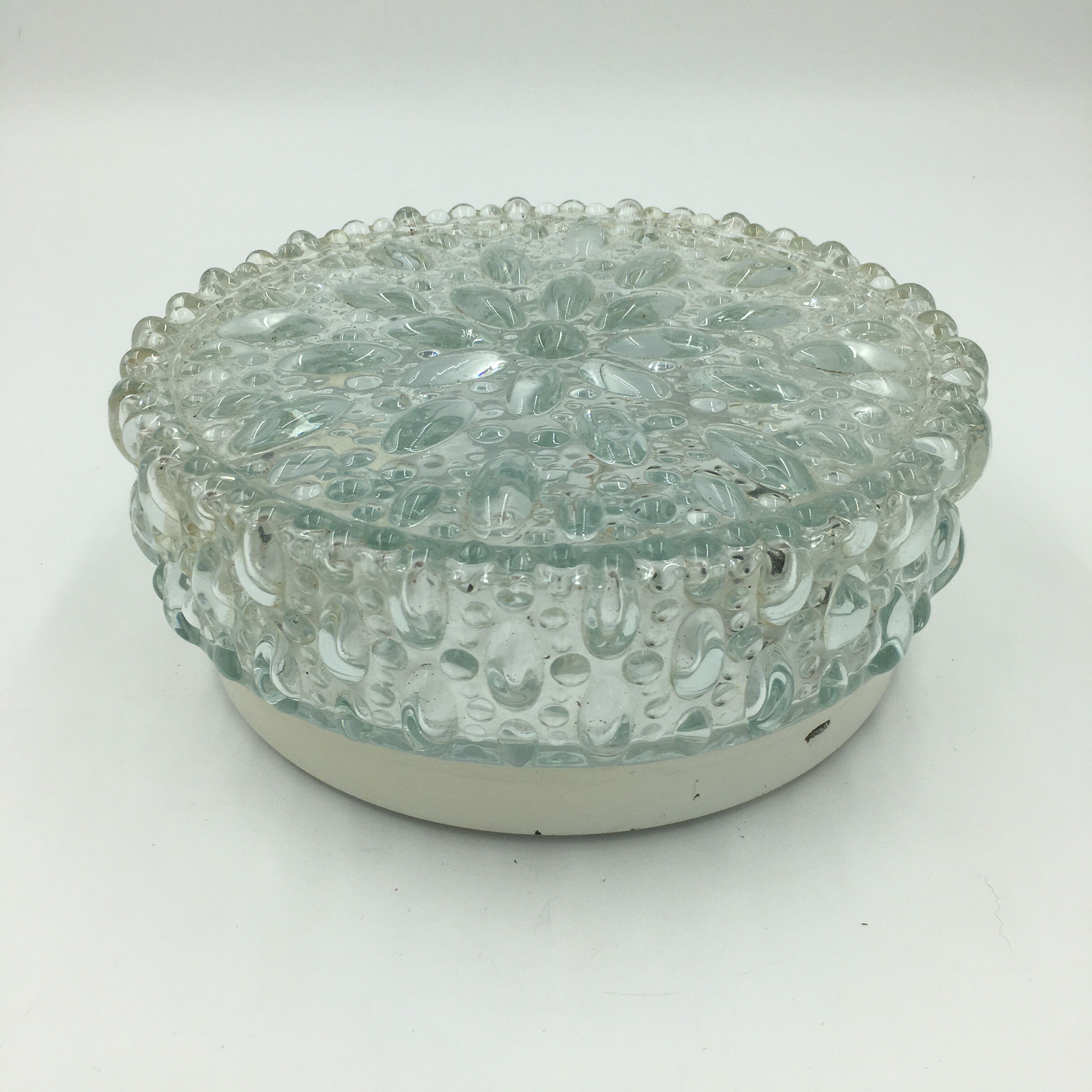 Round ceiling lamp in molded glass with relief