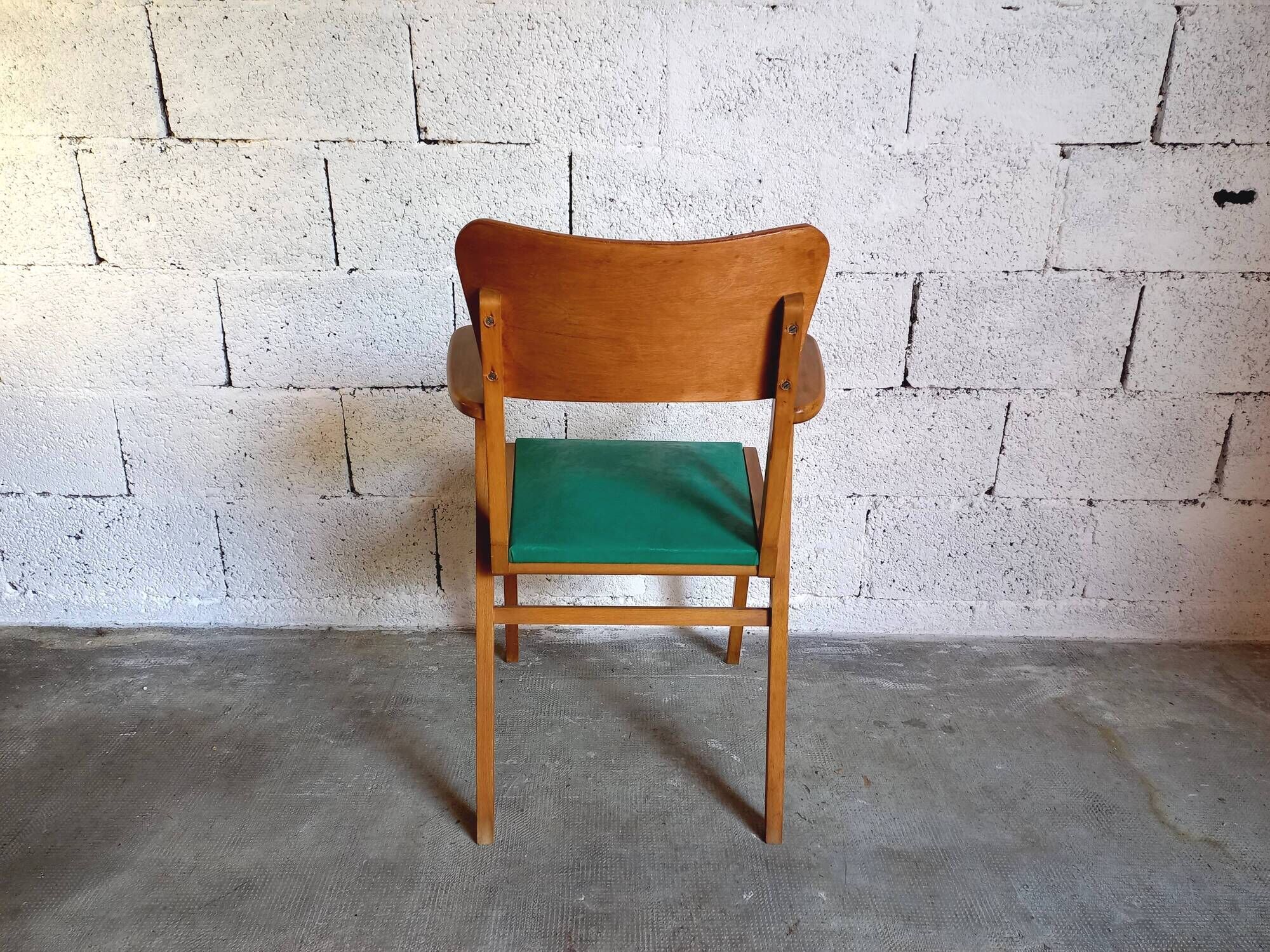 Vintage armchair in skai and wood 60s