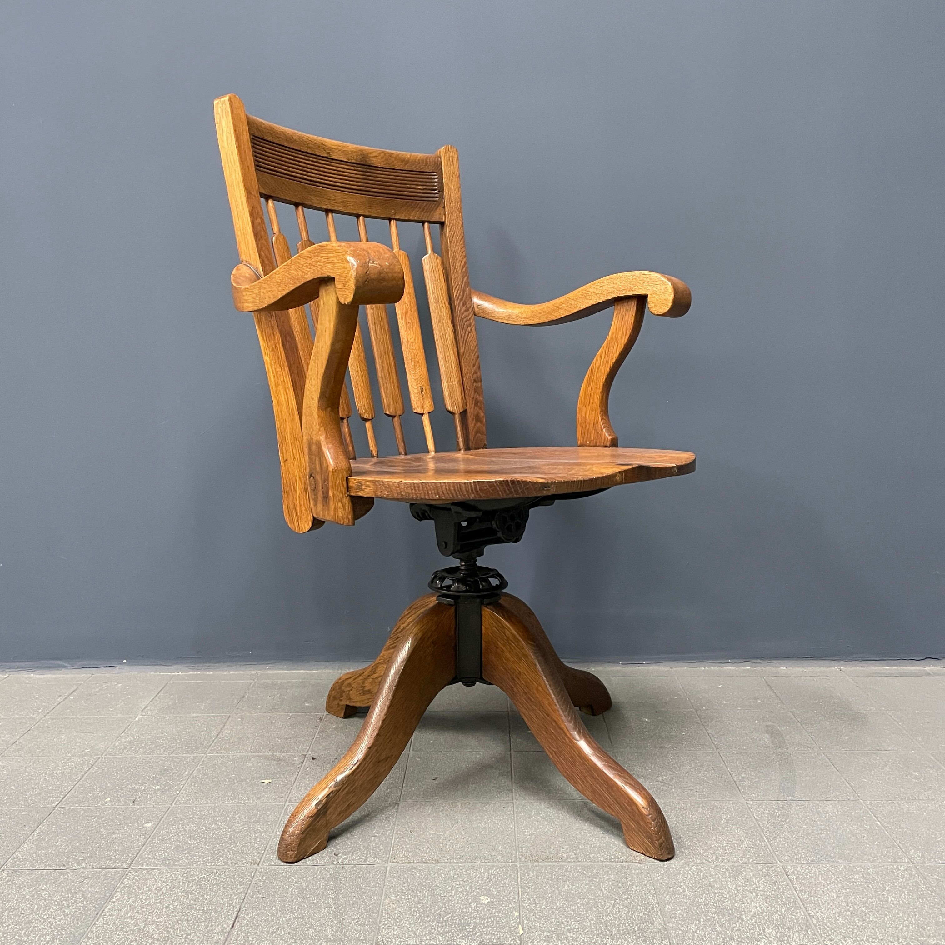 Antique American oak office chair with armrests 1920s