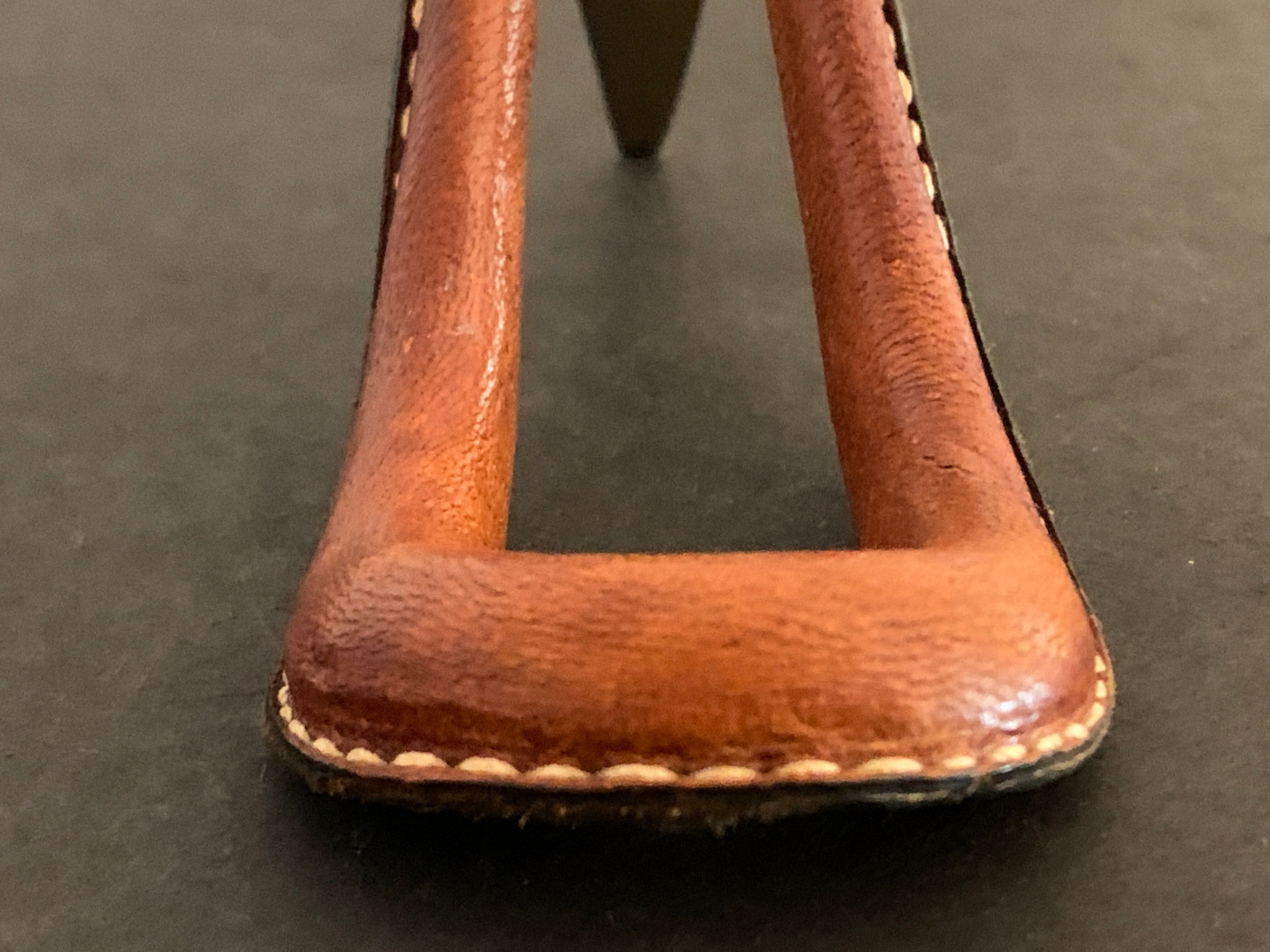 Carl Auböck pipe rack in leather and bronze, 1963