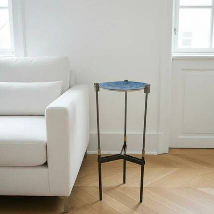 Vintage tripod metal side table with a blue brass bowl.