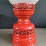 Vintage globe lamp with a metal base, perforated and lacquered in red.