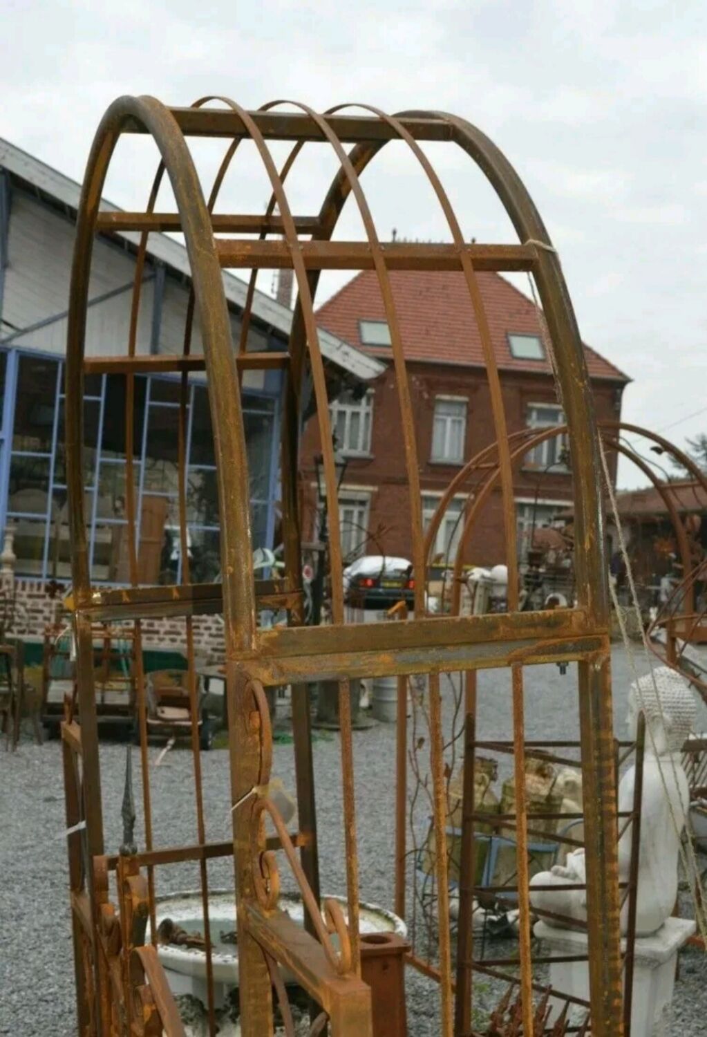 Garden arch with wrought iron gate