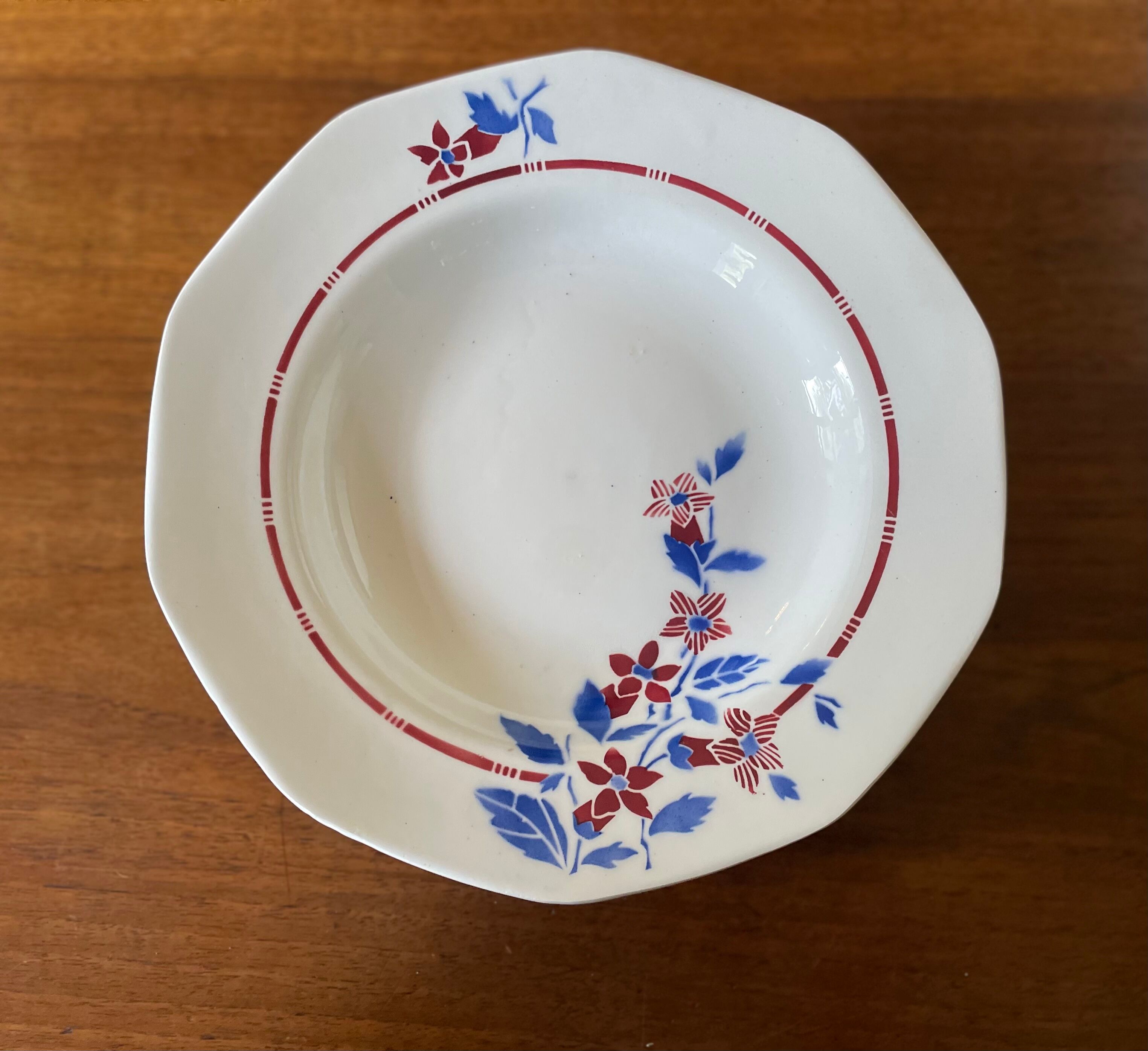 Saint Amand hollow plates decorated with red and blue flowers