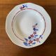 Saint Amand hollow plates decorated with red and blue flowers