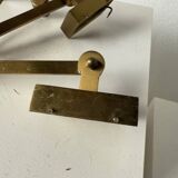 Pair of brass wall lights with articulated arms from the 70s