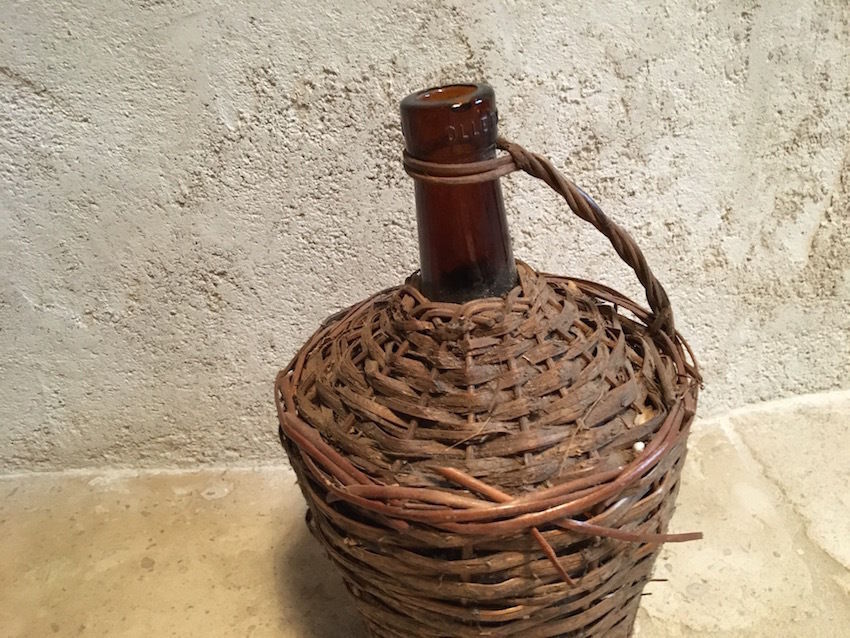 Tank in old glass and wicker